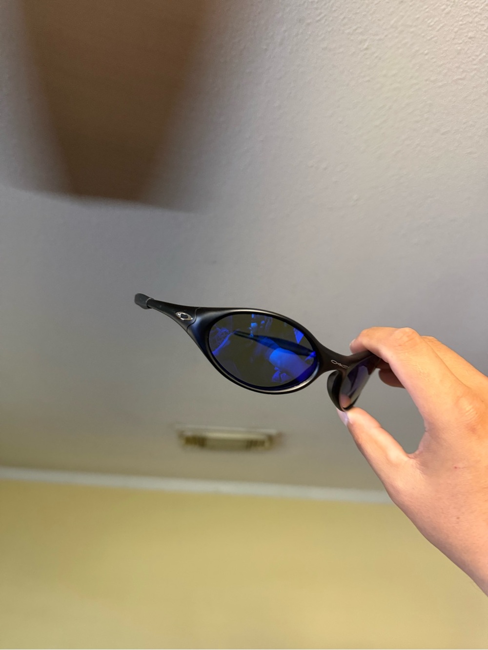 Oakley Black Frame with Blue Mirrored Lenses Sunglasses
